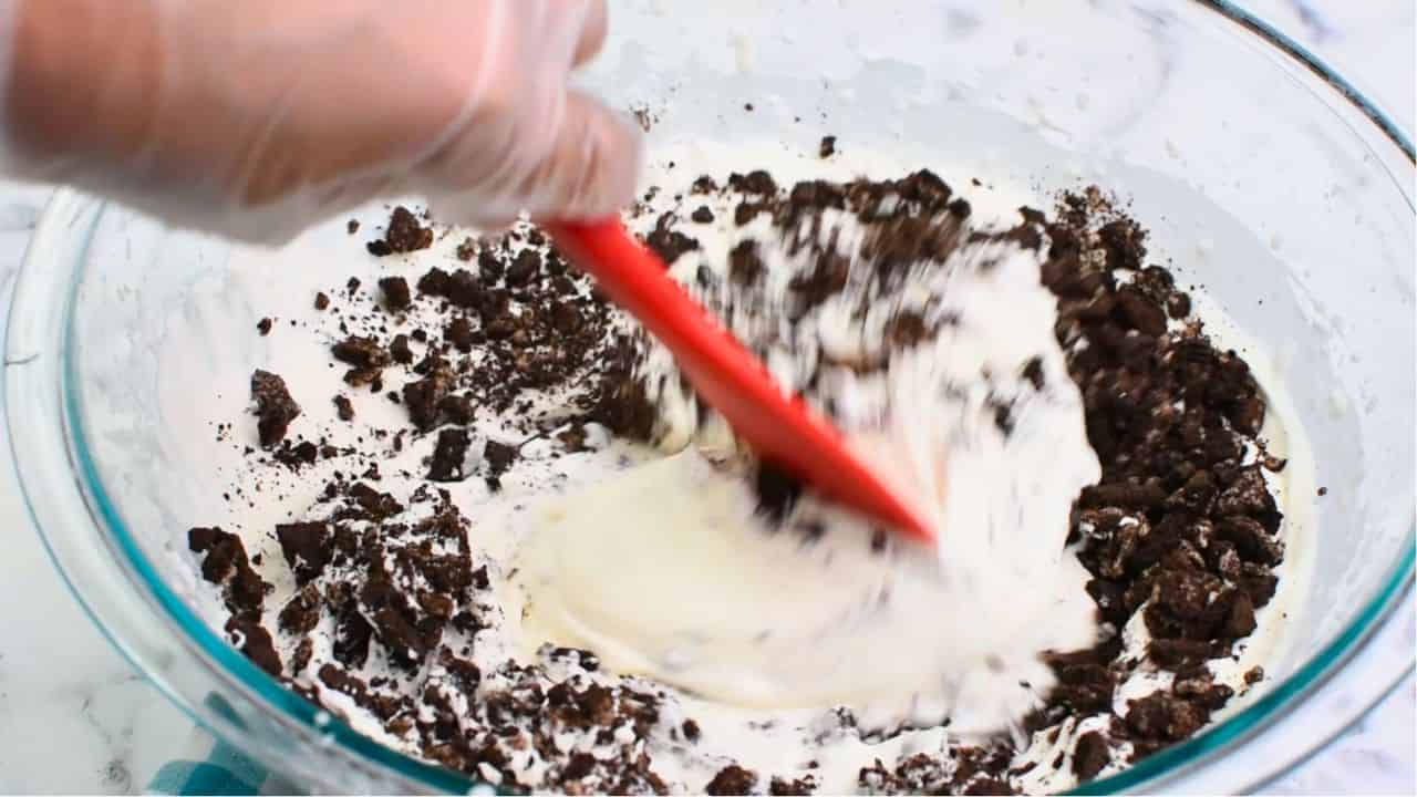folding in the crushed oreos with a spatula