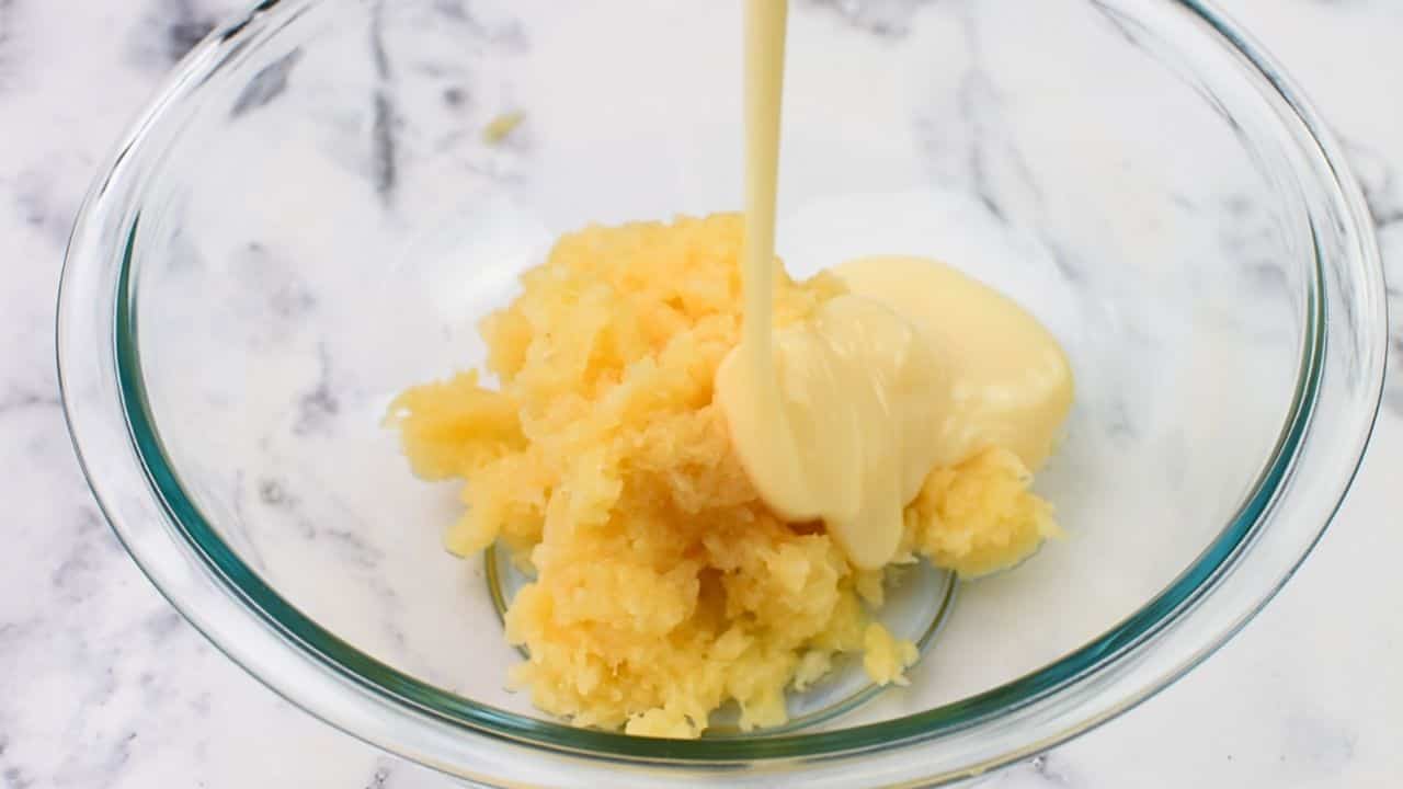 Mixing crushed pineapple and condensed milk